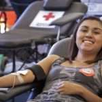 August 29, 2012. Utah State University, Logan, Utah. 18-year-old Amanda Guzman is all smiles knowing that her donation makes a difference. Photo by Jody Lane/American Red Cross